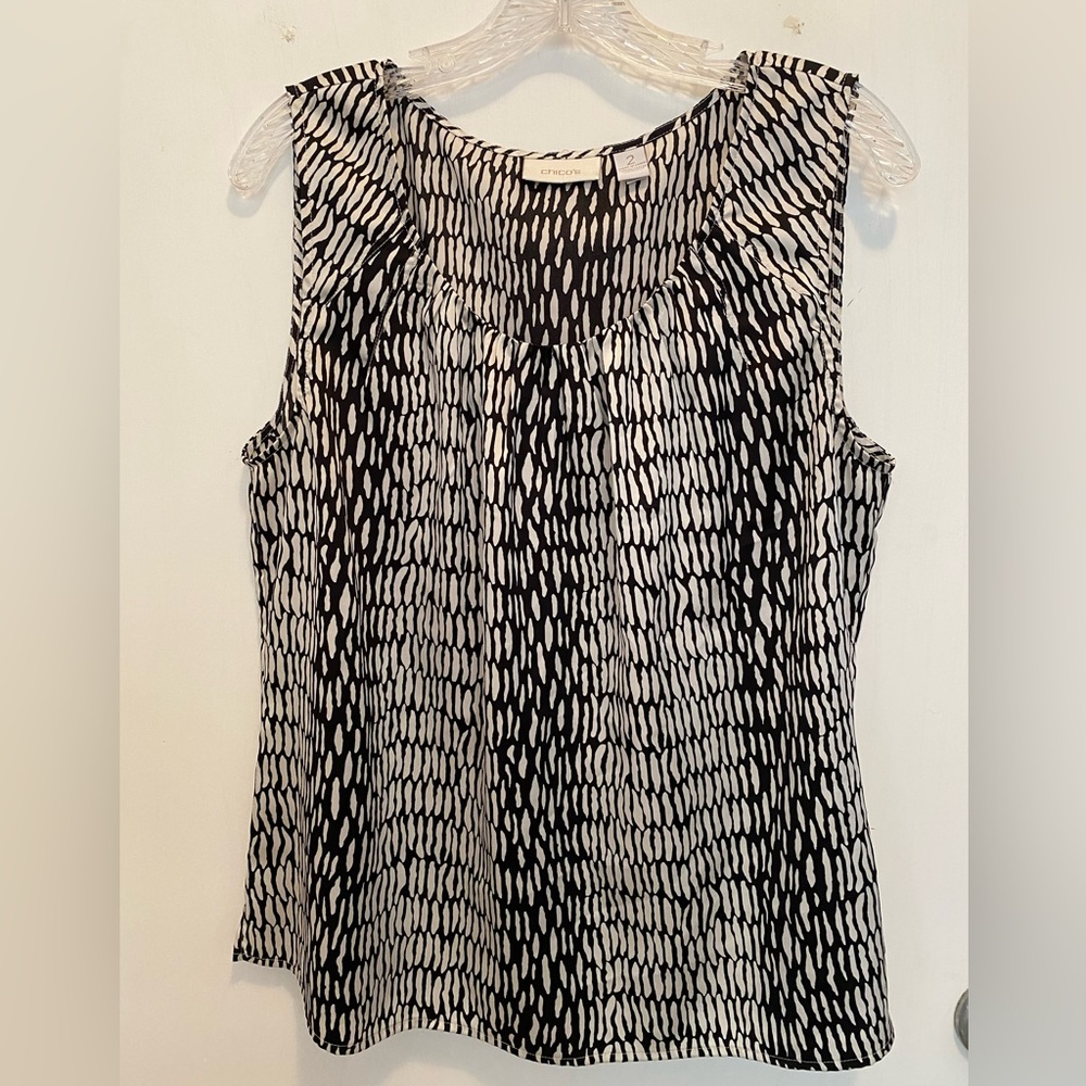Used Chico’s sleeveless black & beige sleeveless blouse. Size 2(12)